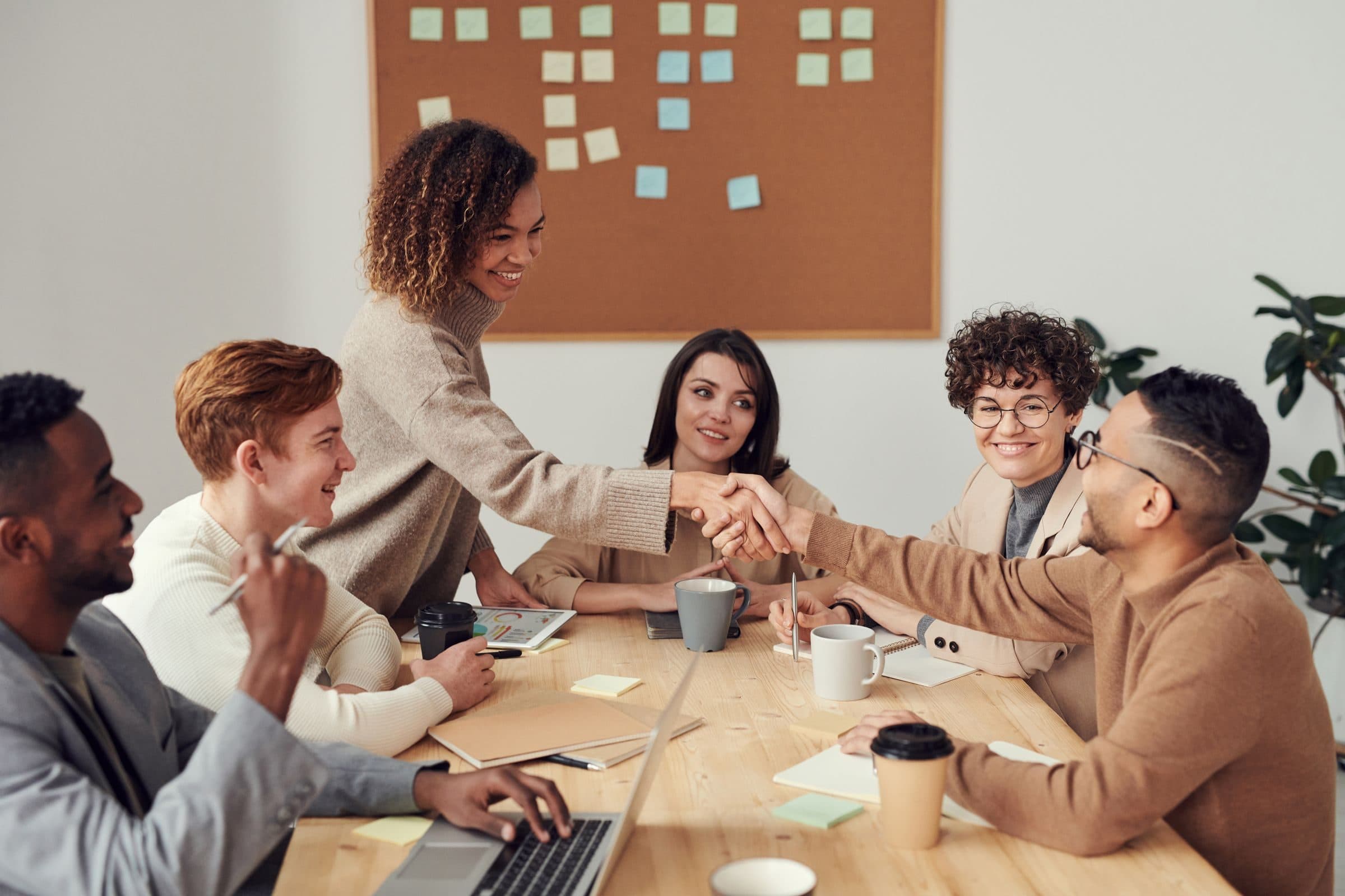 JDL Strategies advisor shaking hands with an investor during a strategy meeting
